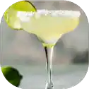 Margarita cocktail with lime and salt rim.