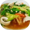 Seafood stir-fry with vegetables and sauce.