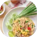 Plate of fried rice with vegetables.
