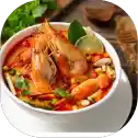 Spicy shrimp soup with lime garnish.