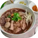 Bowl of noodle soup with beef.