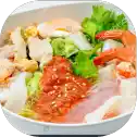 Mixed seafood salad in a white bowl.