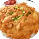 Crispy omelette with green onions and sauce.