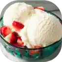 Vanilla ice cream with fresh strawberries.
