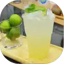 Refreshing lime drink with ice and mint.